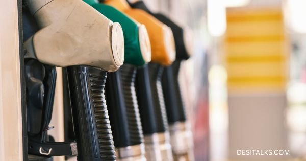 Petrol and diesel prices in major Indian cities displayed at a fuel station.