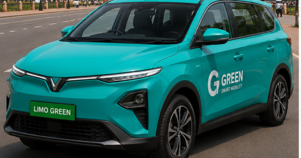 VinFast EV in taxi electric cab plan with cyan electric MPV on Indian road.